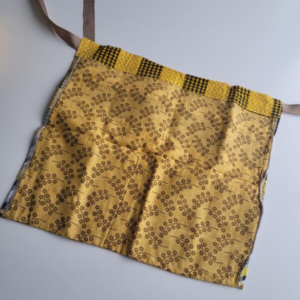 Yellow market apron back