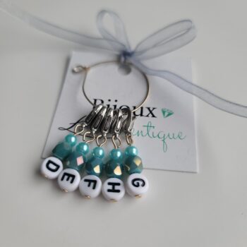 5 lettered stitch markers with teal beads