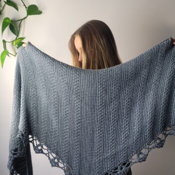 Orchard Tunisian crochet shawl held in front of model